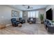 Spacious living room with ample seating, natural light, and stylish decor at 379 Mano Destra Ln, Henderson, NV 89011