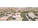 An aerial view of a neighborhood with single-Gathering homes and green trees under a clear sky at 379 Mano Destra Ln, Henderson, NV 89011