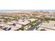 A panoramic aerial view displays an extensive suburban area with uniform rooftops and scenic mountain backdrop at 379 Mano Destra Ln, Henderson, NV 89011