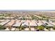 A bird's eye view highlights a residential area with uniform houses, and manicured lawns under a bright sky at 379 Mano Destra Ln, Henderson, NV 89011