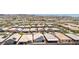 Expansive aerial view of a desert community featuring single-story homes with well-maintained landscaping at 379 Mano Destra Ln, Henderson, NV 89011