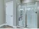 Walk-in shower with a glass door and modern fixtures at 379 Mano Destra Ln, Henderson, NV 89011
