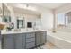 Bathroom with double sink vanity, soaking tub, and walk-in shower at 3966 Crystal Trip Ct, Las Vegas, NV 89129