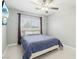 Cozy bedroom with a ceiling fan, a comfortable bed, and a window providing natural light at 3966 Crystal Trip Ct, Las Vegas, NV 89129