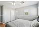 Bedroom with light walls, carpet flooring, ceiling fan, and a closet with sliding doors and dual windows at 3966 Crystal Trip Ct, Las Vegas, NV 89129