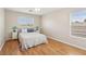 Bright bedroom with hardwood floors, neutral walls, and a ceiling fan at 3966 Crystal Trip Ct, Las Vegas, NV 89129