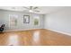 Spacious bonus room with hardwood floors, bright windows, and ample space for furniture or activities at 3966 Crystal Trip Ct, Las Vegas, NV 89129