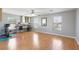 Large bonus room with hardwood floors, work stations, ample space, and multiple windows for natural light at 3966 Crystal Trip Ct, Las Vegas, NV 89129