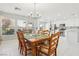 Open-concept dining area with kitchen views, flooded with natural light from large windows at 3966 Crystal Trip Ct, Las Vegas, NV 89129