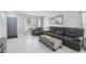 Comfortable living room featuring tile floors, modern furniture, and lots of natural light at 3966 Crystal Trip Ct, Las Vegas, NV 89129