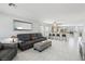 Bright and airy living room, seamlessly connected to the kitchen with a breakfast bar and modern appliances at 3966 Crystal Trip Ct, Las Vegas, NV 89129
