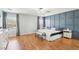 Spacious main bedroom featuring custom wall, light gray walls, and hardwood floors at 3966 Crystal Trip Ct, Las Vegas, NV 89129