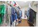 Well-organized walk-in closet with ample hanging space and built-in shelving at 3966 Crystal Trip Ct, Las Vegas, NV 89129