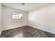 Bright bedroom with laminate floors and bright window overlooking the street at 4016 Stormcrest Dr, Las Vegas, NV 89107