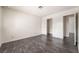 Bedroom with dark wood floors and adjacent closets provides ample storage space at 4016 Stormcrest Dr, Las Vegas, NV 89107