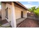 Inviting front porch with security door, stucco pillars, and a desert-friendly landscape design at 4016 Stormcrest Dr, Las Vegas, NV 89107