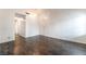 Spacious living room with dark wood floors, an entry door, and natural light at 4016 Stormcrest Dr, Las Vegas, NV 89107