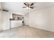 Open-concept living area with tile flooring, view to the kitchen, and bright natural light at 4016 Stormcrest Dr, Las Vegas, NV 89107