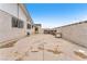 Backyard featuring a concrete area and block wall with gated access at 4386 El Cebra Way, Las Vegas, NV 89121