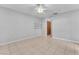 Bedroom featuring tile floor, window with security bars, shelves, and ceiling fan at 4386 El Cebra Way, Las Vegas, NV 89121