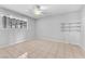 Bedroom featuring tile floor, window with security bars, and ceiling fan at 4386 El Cebra Way, Las Vegas, NV 89121