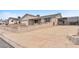 Single story home with a long driveway and decorative privacy wall leading up to the front door at 4386 El Cebra Way, Las Vegas, NV 89121