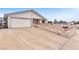 Exterior shot of single story house with a concrete driveway at 4386 El Cebra Way, Las Vegas, NV 89121