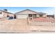Modest single-story home with driveway, low fencing, and barred windows at 4386 El Cebra Way, Las Vegas, NV 89121