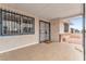 Exterior front porch featuring barred windows and security front door at 4386 El Cebra Way, Las Vegas, NV 89121
