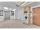 Open concept kitchen features white oven and microwave with tile flooring at 4386 El Cebra Way, Las Vegas, NV 89121