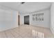 Bright living room with tiled floors and natural light coming through the windows at 4386 El Cebra Way, Las Vegas, NV 89121