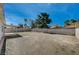 Spacious backyard with potential for landscaping and outdoor living, enclosed by block and wood fencing at 4496 Skyview Dr, Las Vegas, NV 89104
