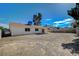 Large backyard featuring a block wall, patio cover, and plenty of space for outdoor activities at 4496 Skyview Dr, Las Vegas, NV 89104