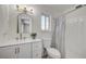 Updated bathroom featuring a new vanity, modern lighting, and a shower with a stylish curtain at 4496 Skyview Dr, Las Vegas, NV 89104