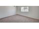 Light-filled bedroom featuring a neutral carpet and a window at 4496 Skyview Dr, Las Vegas, NV 89104