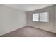 Well-lit bedroom with a window and neutral carpeting at 4496 Skyview Dr, Las Vegas, NV 89104