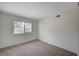 Empty bedroom featuring neutral carpet, a window, and fresh paint at 4496 Skyview Dr, Las Vegas, NV 89104