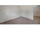 Clean bedroom with carpet, closet, and access to bathroom at 4496 Skyview Dr, Las Vegas, NV 89104