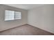Bright bedroom featuring neutral carpeting and a window for natural light at 4496 Skyview Dr, Las Vegas, NV 89104