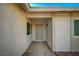 Covered front porch with security door and modern exterior lighting at 4496 Skyview Dr, Las Vegas, NV 89104
