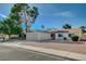 Charming single-story home with mature tree, wide driveway, and desert landscaping at 4496 Skyview Dr, Las Vegas, NV 89104