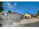 Attached garage with wide driveway and low-maintenance desert landscaping at 4496 Skyview Dr, Las Vegas, NV 89104