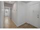 Inviting hallway with wood-style flooring and a view leading to the bathroom at 4496 Skyview Dr, Las Vegas, NV 89104