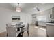 Eat-in kitchen features modern lighting, stainless steel appliances, and hardwood floors at 4496 Skyview Dr, Las Vegas, NV 89104