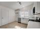 Bright kitchen with sleek appliances, white cabinets, and a large window at 4496 Skyview Dr, Las Vegas, NV 89104