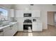 Well-lit kitchen showcasing stainless steel appliances and white cabinetry at 4496 Skyview Dr, Las Vegas, NV 89104