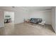 Open floor plan with living room and dining area; wood-look tile flooring throughout at 4496 Skyview Dr, Las Vegas, NV 89104