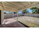 Covered patio area offering shade and outdoor living space overlooking the backyard at 4496 Skyview Dr, Las Vegas, NV 89104