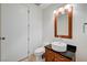 Bathroom with stylish vanity and sink, wood cabinet, and large mirror with modern lighting at 4525 Dean Martin Dr # 909, Las Vegas, NV 89103