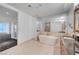 Modern bathroom with soaking tub, double sinks, and neutral tile flooring at 4525 Dean Martin Dr # 909, Las Vegas, NV 89103